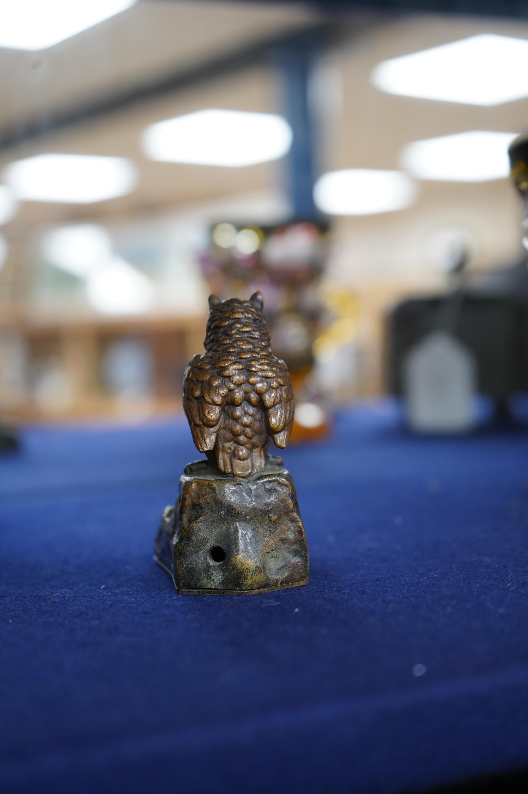 An Austrian cold painted bronze bellpush modelled as a perched owl, 7.5cm high. Condition - fair.